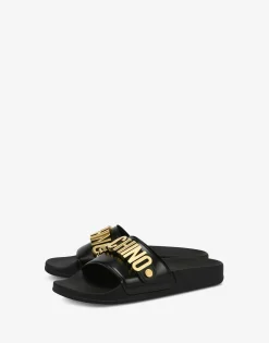 Moschino Sandals & Mules^Lettering Logo PVC pool slides